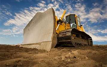 Heavy equipment rental fleet on an industrial site